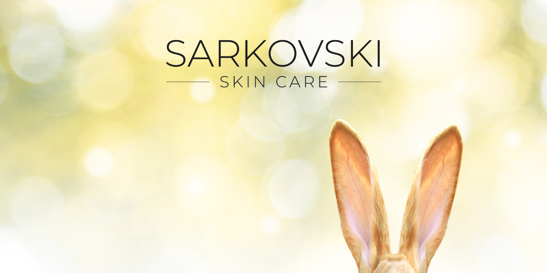 SARKOVSKI Skin Care logo with a soft, glowing background and the ears of a rabbit peeking from the bottom, symbolising cruelty-free and gentle skincare.