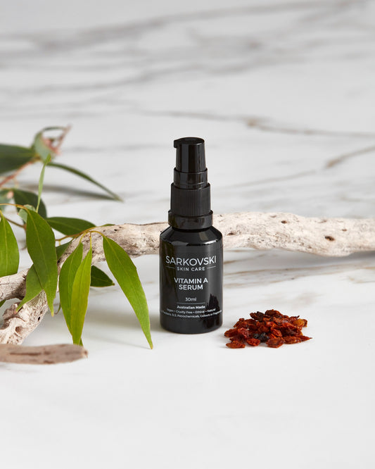 a photo SARKOVSKI® Vitamin A Serum 30mL, with dried wooden stick and berries with fresh leaves. SARKOVSKI® Vitamin A Serum 30mL, natural Australian skincare, a potent, plant-based formula designed to combat sun damage, acne, and signs of premature aging. 